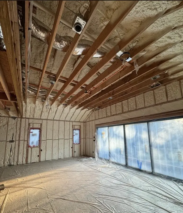 Interior walls and ceiling insulated with spray foam during new construction in Belle Isle